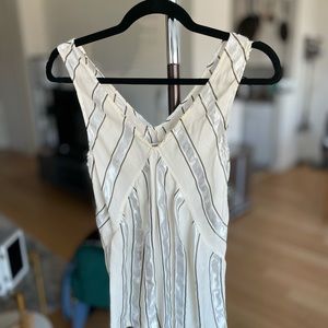 Date night friendly cream and grey lines sleeveles top.